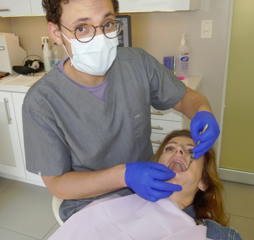 dentist inspecting dr natalie archer DDS teeth at Archer Dental