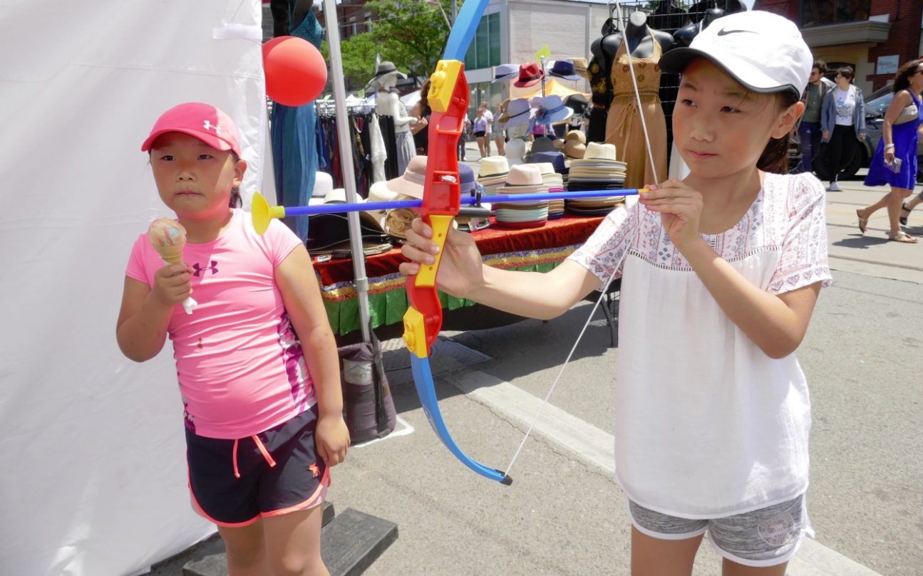 shy sister truies shoot the tooth archery game at Archer Dental