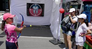 action hero sister shows shy counterpart how to hit the target