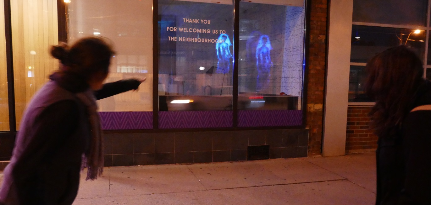 pedestrians spot the ghost in the store window from the sidewalk, 564 College St Toronto