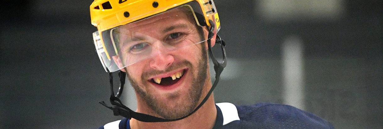 hockey player needs dental implants